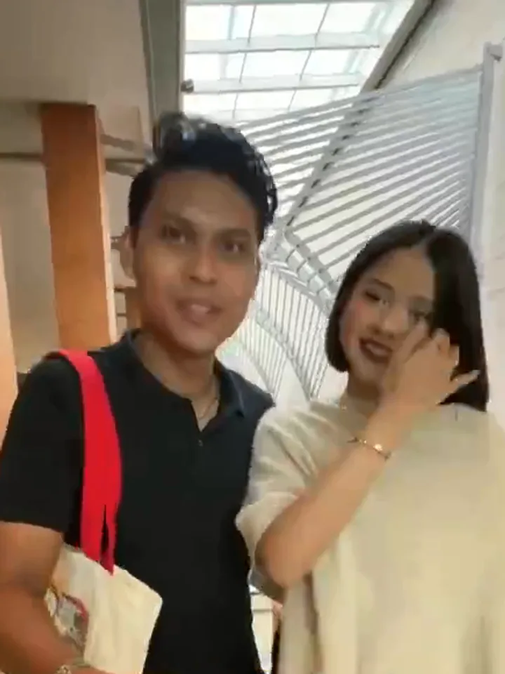 Adli and Dhaniya on the day they got their first home